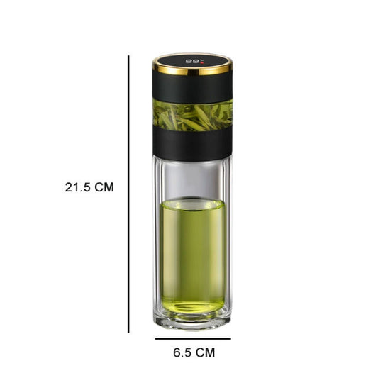 The Smart water boatel is a glass container with a black and gold lid, filled with green liquid. Measuring 21.5 cm tall and 6.5 cm wide, it's perfect for stylishly meeting your hydration needs.